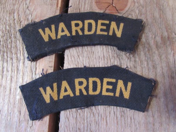 Pair of wartime warden shoulder titles (material)