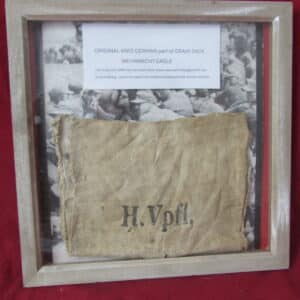 An original WW2 German Army Supply Service relic, consisting of a framed section of a wartime grain or provisions sack