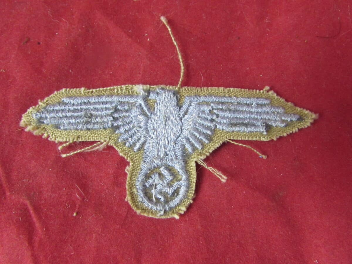 These tropical Heer breast eagles are considerably scarcer than the standard Army breast eagles intended for the familiar field-grey German Army uniform, making surviving original examples particularly desirable to collectors of German militaria, Afrika Korps uniforms and WWII tropical insignia.