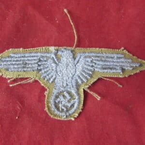 These tropical Heer breast eagles are considerably scarcer than the standard Army breast eagles intended for the familiar field-grey German Army uniform, making surviving original examples particularly desirable to collectors of German militaria, Afrika Korps uniforms and WWII tropical insignia.